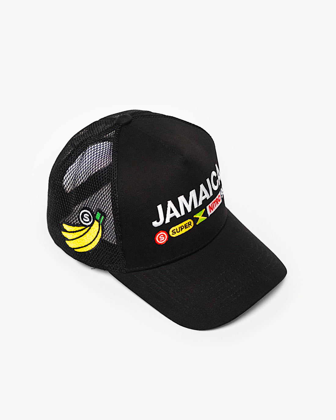 Side view of a stylish black snapback hat showcasing side patchwork, with intricate Jamaica-inspired patches on the front and a cooling mesh rear design.