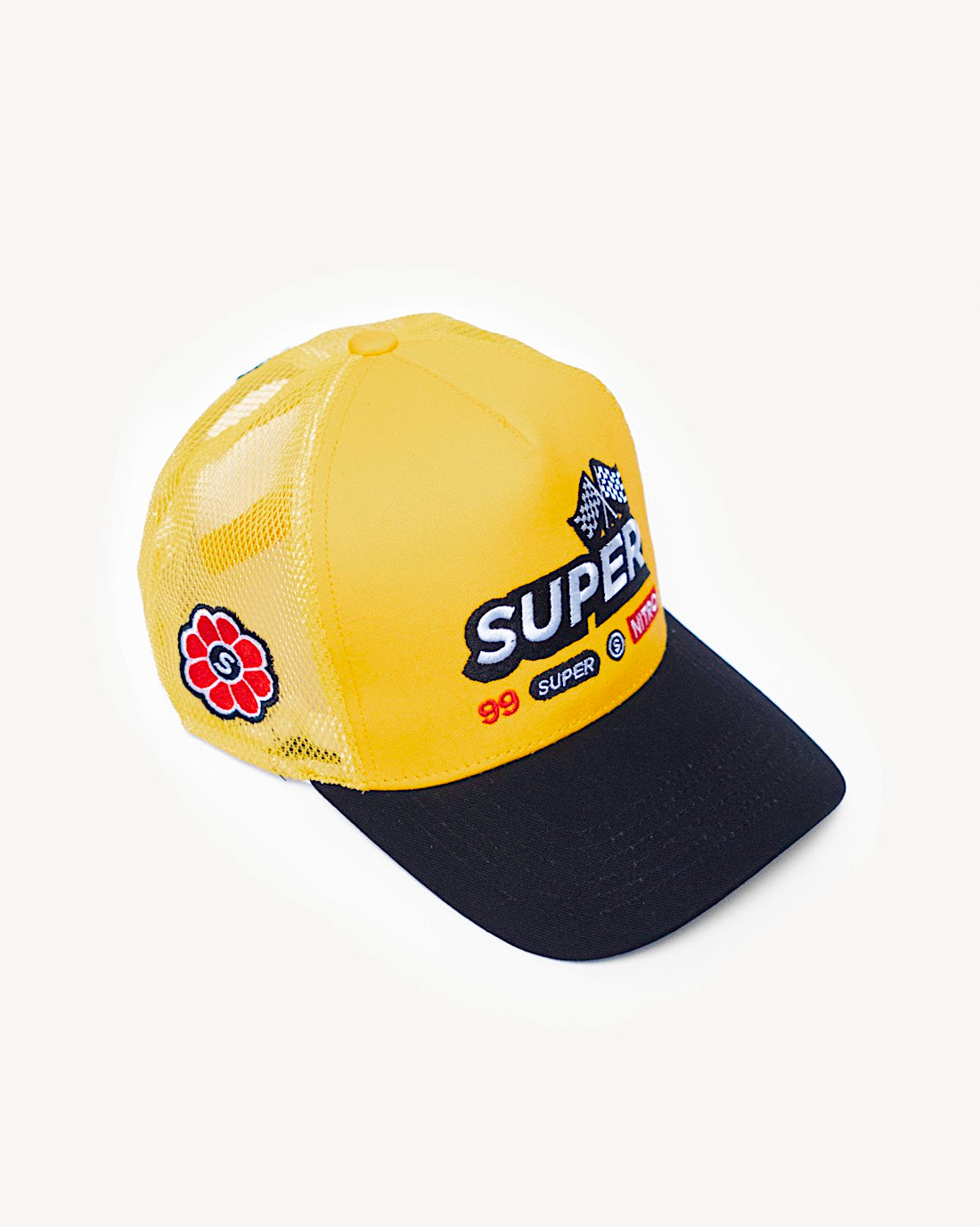 Side view of a colorful two-toned yellow and black snapback hat showcasing side patch design of flower, with designer racing-inspired patches on the front and a cooling mesh rear design.