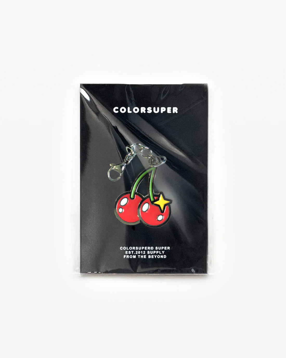 Cherry Pop Bikini charm with glossy red cherries on packaging, perfect for bags and keys.