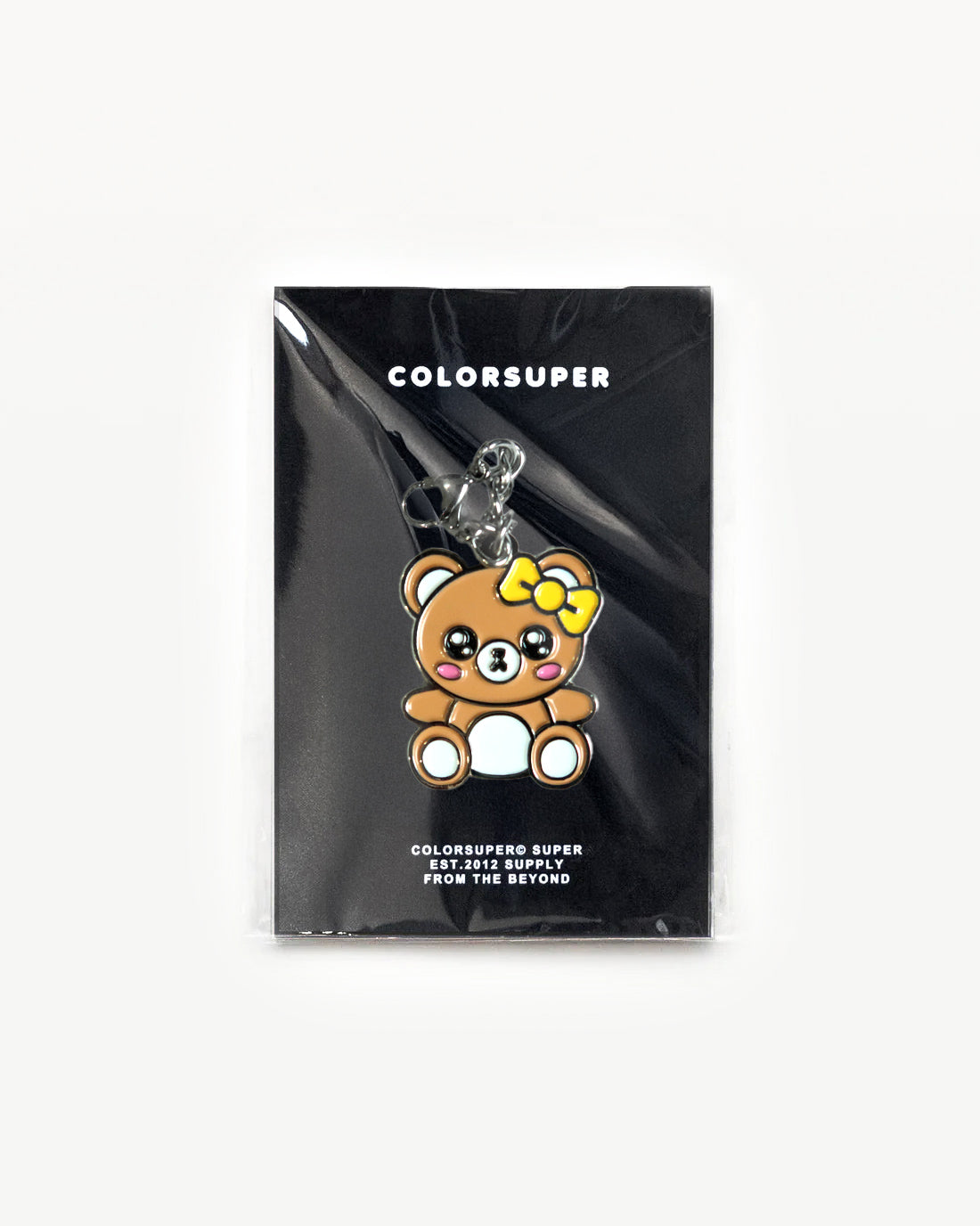 Cute Bear charm with a big bow, designed for everyday style and soft vibes, showcased in clear packaging.