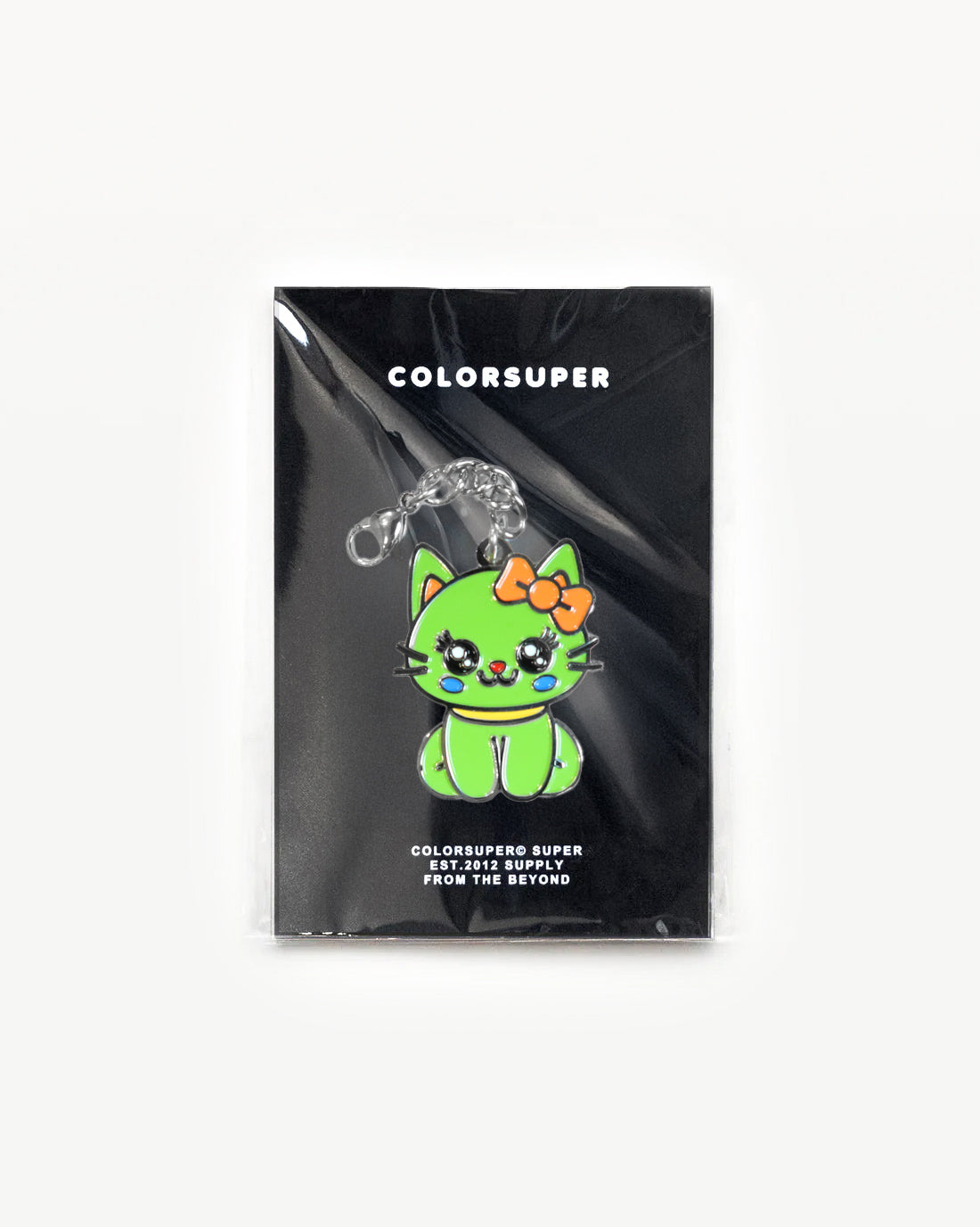 Cute green cat charm with a red bow, packaged and ready to give off cool-cat vibes.