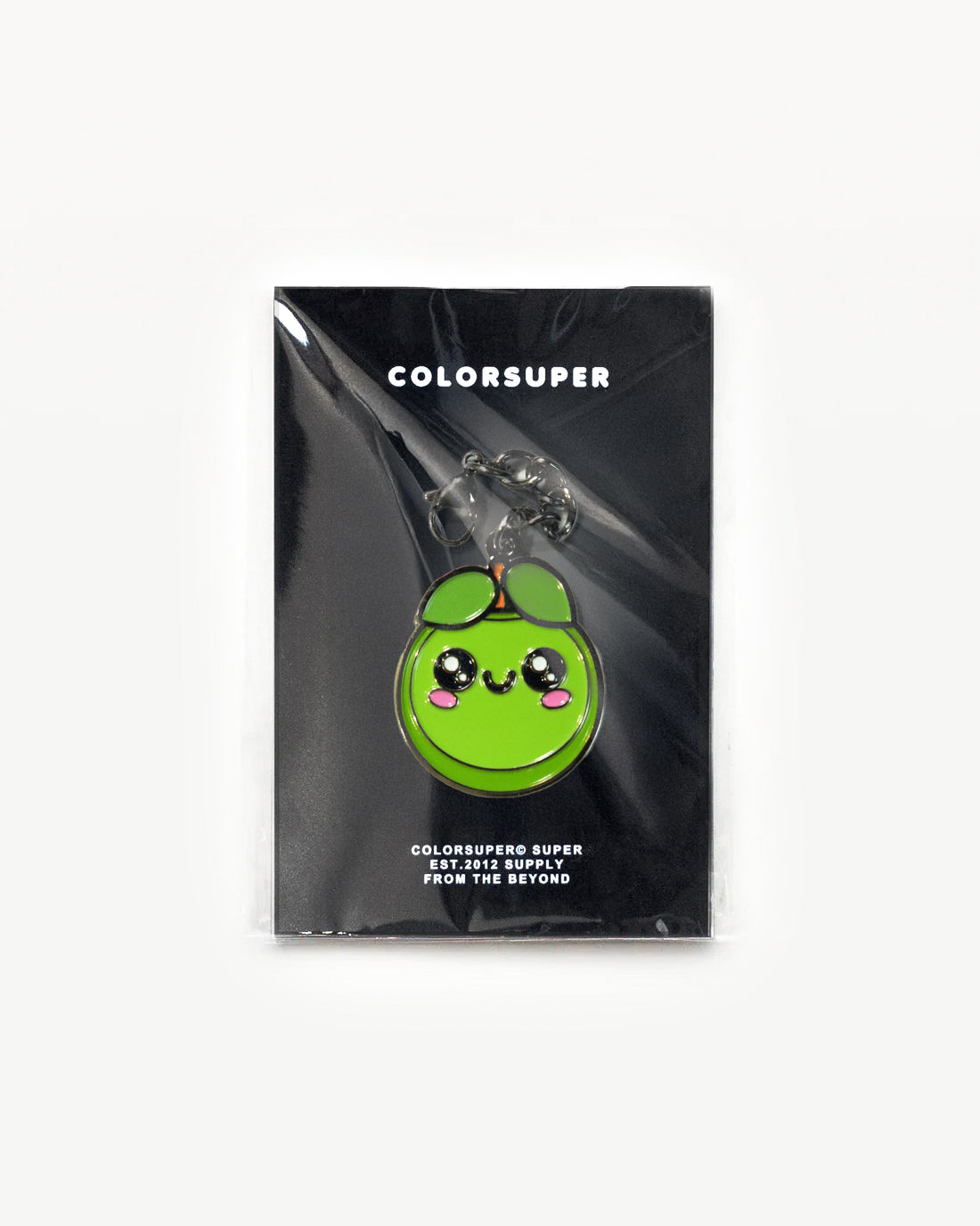 Cute green fruit charm with smiling face, packaged and ready for fun fashion accessories.