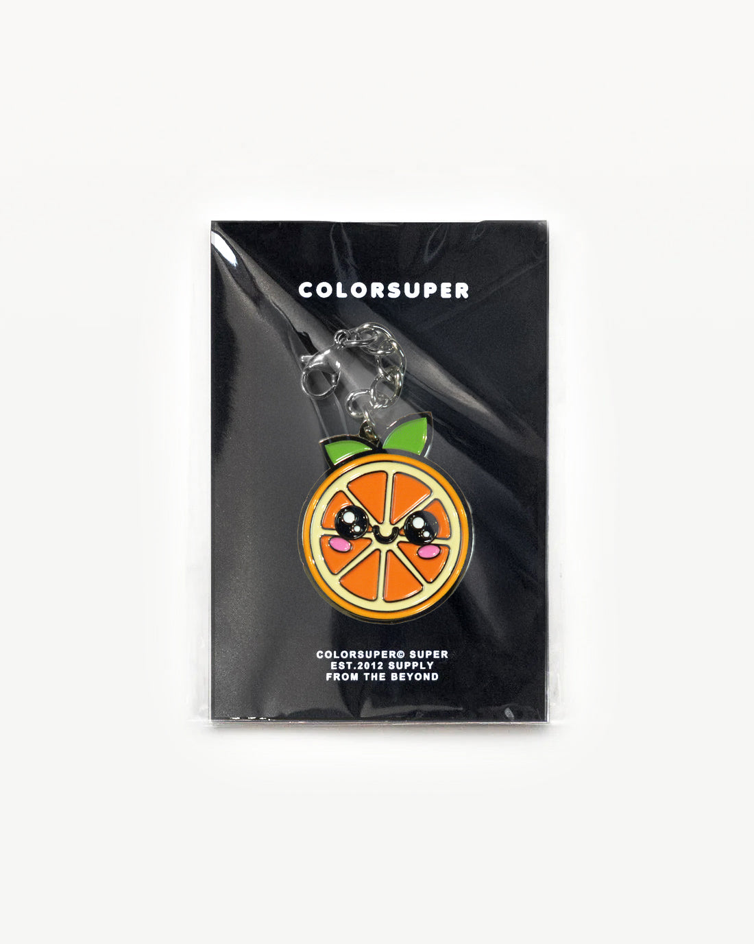 Juicy Fruit Orange charm with happy face, vibrant colors, packaged for display, adding cheerful energy.