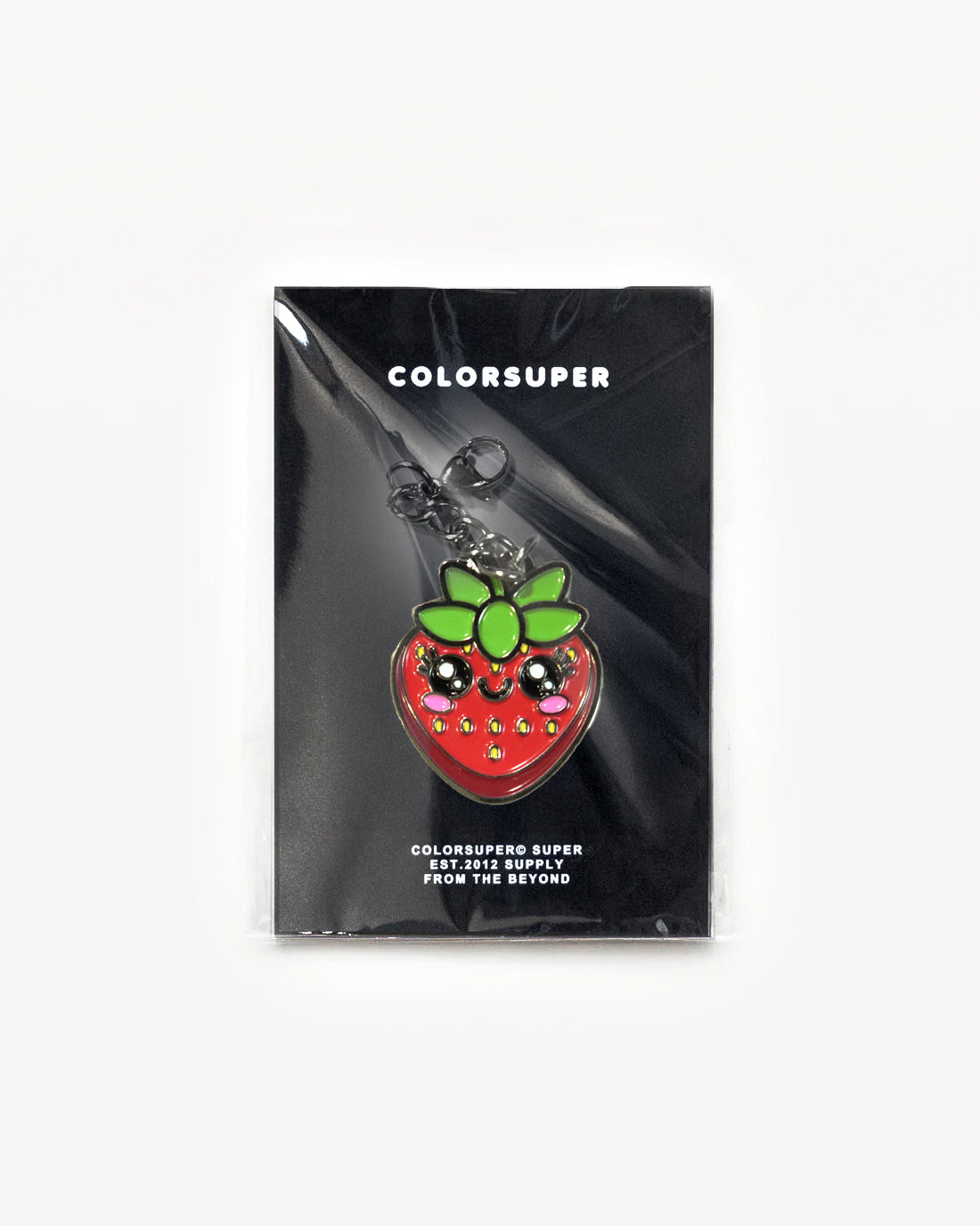 Juicy Fruit Strawberry charm by Colorsuper, shiny red with cute face and green leaves on a display card.
