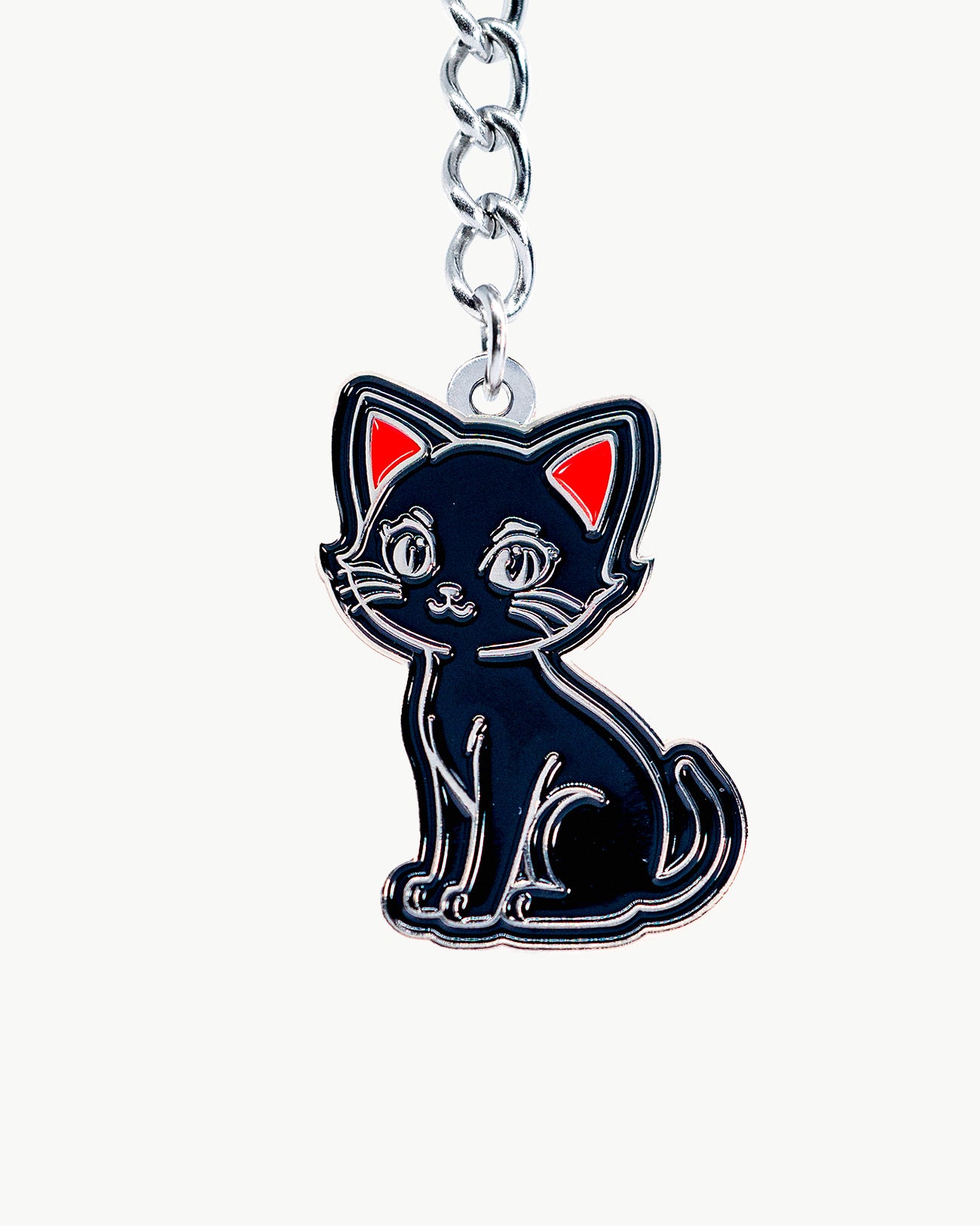 Cute black kitten charm with red ears, perfect for cat lovers and kawaii accessories.