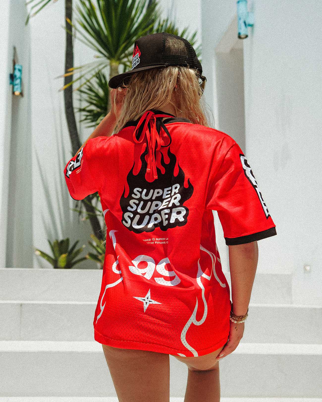 Oversized red jersey with flame design, featuring 'SUPER SUPER SUPER' text, perfect for summer street style.