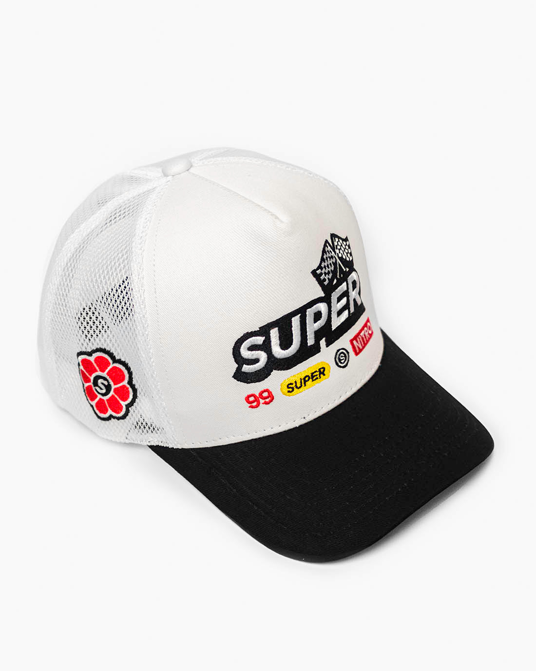 Front side view of a two-tone black and white snapback hat with colorful racing-inspired embroidered design and cooling mesh back.