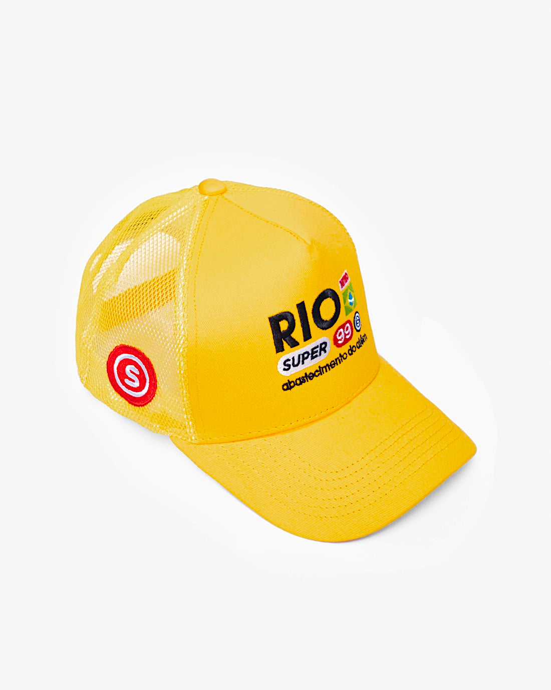 Side view of a vibrant yellow snapback hat showcasing side patch design, with designer Brazilian-inspired patches on the front and a cooling mesh rear design.