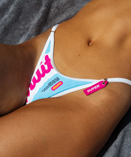 In an intimate close-up shot, the front bottom of the vibrant summer thong-style bikini with adjustable sides takes center stage, showcasing its playful design and lively color palette. The comfortable fit and distinctive details, including adjustable sides, add a touch of charm, creating a perfect beach moment with summer vibes.