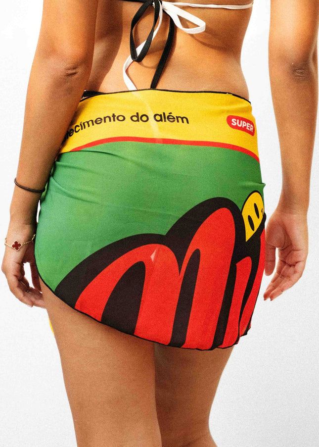 Close up rear view shot of a model showcasing a beautiful light weight black yellow and green Rio inspired sarong.