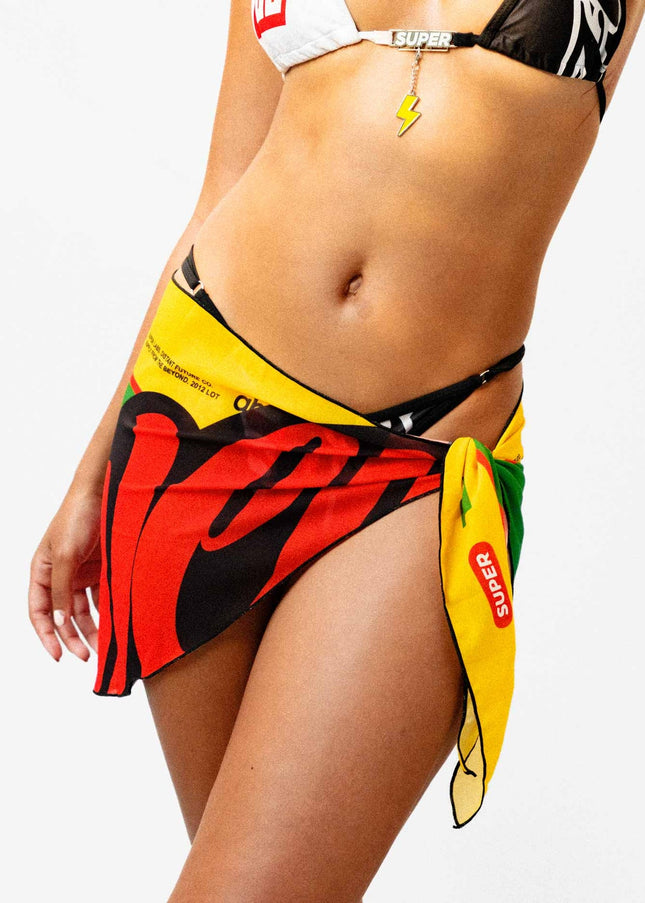 Front shot of a model showcasing a sexy yellow black and green light weight Rio inspired sarong.