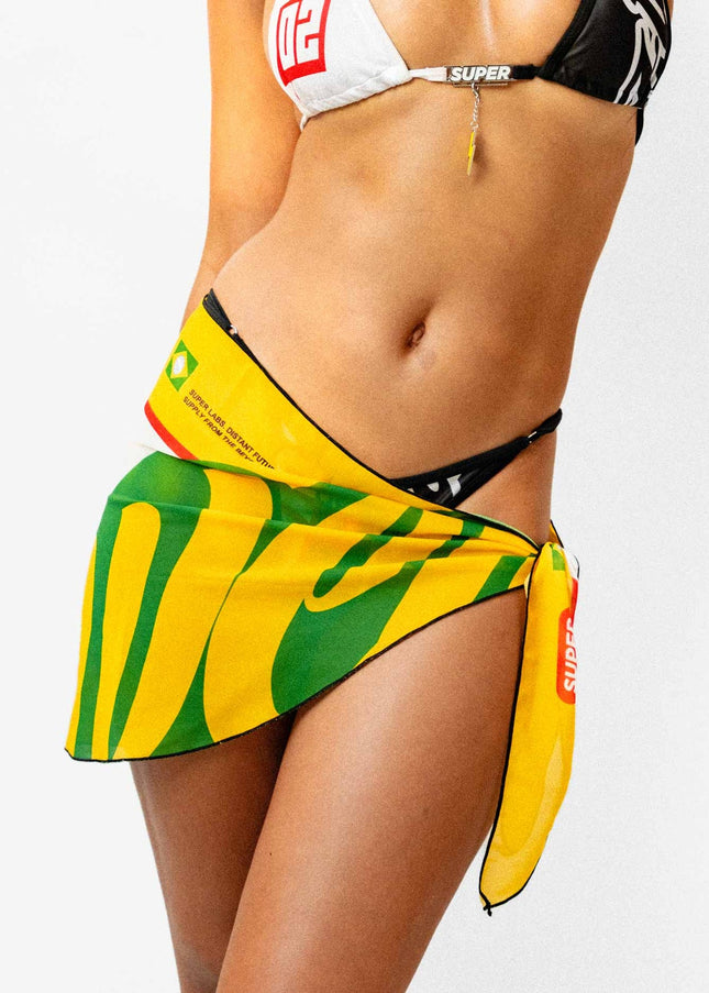 Front shot of a model showcasing a sexy yellow white and green light weight Rio inspired sarong.