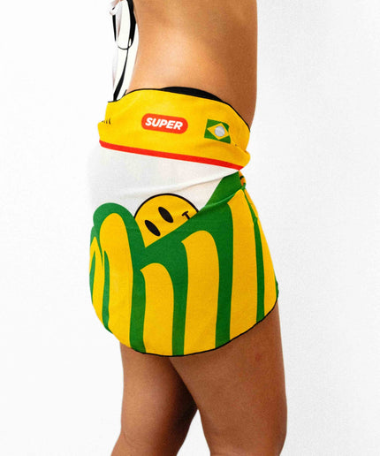 Side shot of a model showcasing a stunning yellow white and green light weight Rio inspired sarong.