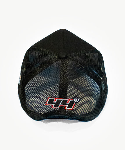 Back side of a super black mesh snapback hat with cute patches.