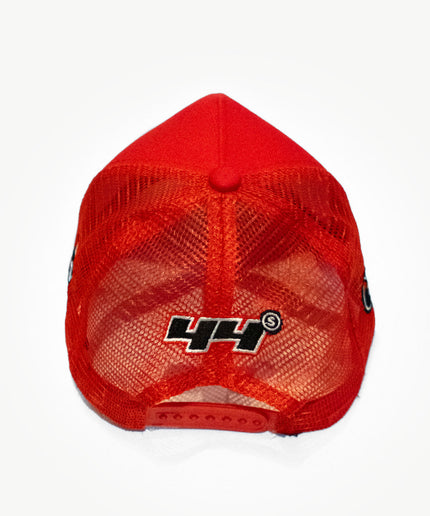 Back side of a super red mesh snapback hat with unique patches.